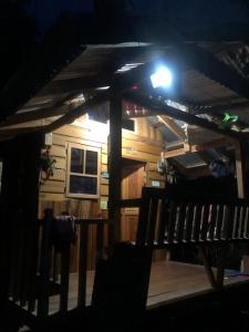 a view of a cabin at night with a light at Little Cabins at Km 499 