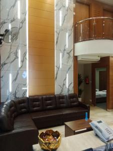 Posezení v ubytování Grand Courtyard Business Hotel