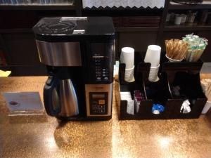 a coffee maker sitting on top of a counter at Kitami Daiichi Hotel in Kitami