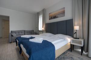 Postel nebo postele na pokoji v ubytování Aparthotel Baltic Spa + 37 fotografií