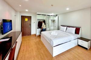 Postel nebo postele na pokoji v ubytování PT Grand Hotel