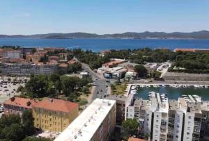 an aerial view of a city and a body of water at New modern APT near Old town - private parking in Zadar
