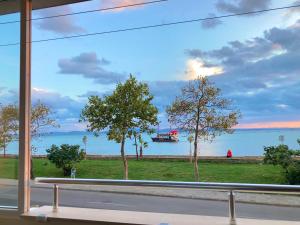 a view of the water from a window at Sunset Yavorov Pomorie in Pomorie