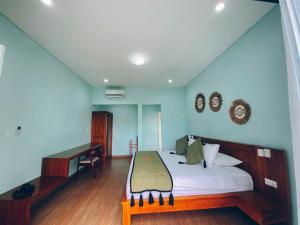 Postel nebo postele na pokoji v ubytování The Green Home Bali