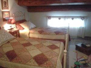 Postel nebo postele na pokoji v ubytování B&B Fonte Cugno