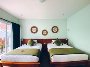 Postel nebo postele na pokoji v ubytování The Green Home Bali