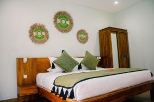 Postel nebo postele na pokoji v ubytování The Green Home Bali
