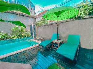 Bazén v ubytování The Green Home Bali nebo v jeho okolí