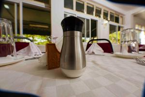 a pepper shaker sitting on top of a table at Acacia Resort Wote-Makueni by Nest & Nomad in Wote