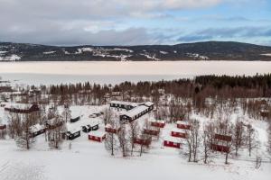 an aerial view of a train station in the snow at Hyttgårdens fjällstugor i Huså, Åre kommun in Huså