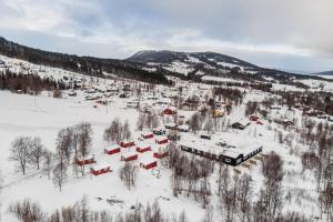 an aerial view of a village in the snow at Hyttgårdens stugby i Huså, Åre kommun in Huså