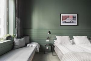 Postel nebo postele na pokoji v ubytování Heimen Hotel