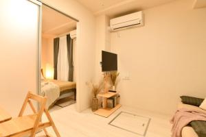 TV a/nebo společenská místnost v ubytování FL Residence Shinjuku II