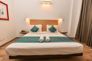 Rúm í herbergi á Hotel A4U sector 45 Gurgaon