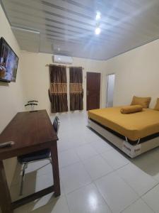 Voodi või voodid majutusasutuse Solo Nadamax City Guest House Syariah toas