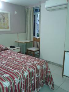 Кровать или кровати в номере Hotel Venezuela