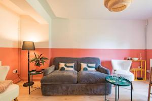 a living room with a couch and a table at The Courtyard in Folkestone