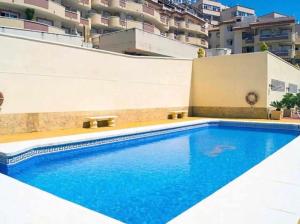 Bazén v ubytování Precioso apartamento en primera línea de playa III nebo v jeho okolí