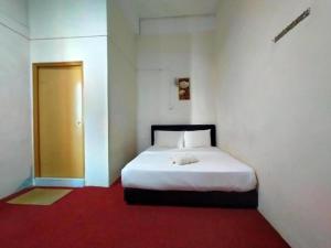 Postel nebo postele na pokoji v ubytování Rz Gold Hotel Official Account