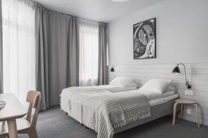 Postel nebo postele na pokoji v ubytování Heimen Hotel