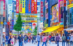 a crowd of people walking down a busy city street at 东京上野超级中心 设计师房间Ycoe 上野公园3分钟 车站1分钟 超级繁华 免费wifi 戴森吹风 in Tokyo