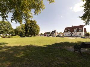 a park with a bench in the middle of a field at Pass the Keys 19th Century Barn with Free Parking in Histon