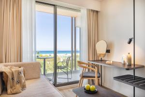 a living room with a view of the ocean at Erato by Samian Mare in Karlovasi