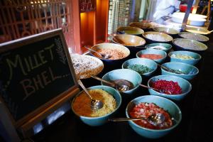 a buffet line with bowls of different types of food at JW Marriott Hotel New Delhi Aerocity in New Delhi