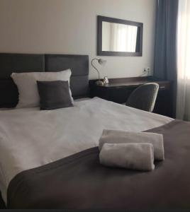 Posteľ alebo postele v izbe v ubytovaní Hotel Maraton