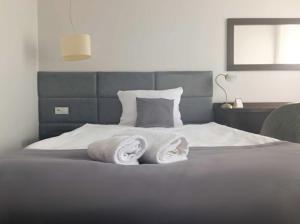 Posteľ alebo postele v izbe v ubytovaní Hotel Maraton