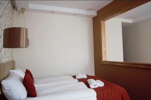 Posteľ alebo postele v izbe v ubytovaní Hotel Maraton