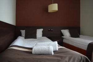 Posteľ alebo postele v izbe v ubytovaní Hotel Maraton