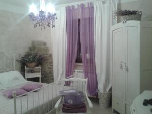 Postel nebo postele na pokoji v ubytování B&B Fonte Cugno