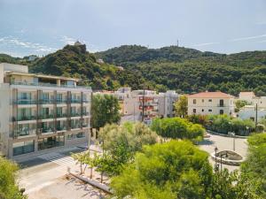 a view of a city with mountains in the background at Erato by Samian Mare in Karlovasi