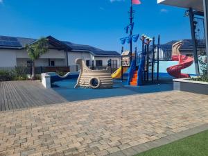 a playground with a slide and a slidesktop at Hills Intweshe in Ballito