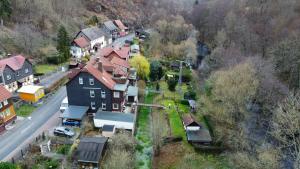 an aerial view of a village with houses and a road at Haus Bodetal in Altenbrak