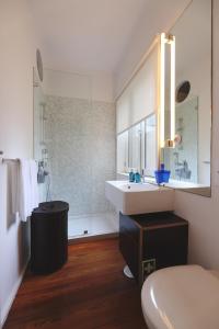 a bathroom with a sink and a tub at Boavista Sunlit Duplex with Terrace in Porto +19 photos