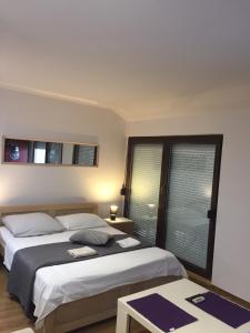Postel nebo postele na pokoji v ubytování Hostel Lega House
