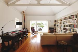 a living room with a couch and a table at Boavista Sunlit Duplex with Terrace in Porto
