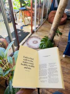 a book sitting on top of a table at Moksha eco villa Ella in Ella