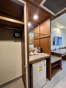 a kitchen with a washer and dryer at Ritz Boutique Hotel in Pattaya South