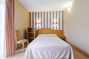 Postel nebo postele na pokoji v ubytování Hostal Don Juan