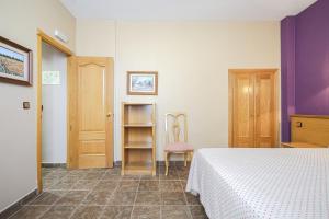 Postel nebo postele na pokoji v ubytování Hostal Don Juan
