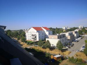 arial view of a city with buildings and a street at Beautiful Maisonette in Mörfelden-Walldorf in Mörfelden-Walldorf