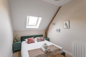 Postel nebo postele na pokoji v ubytování Les Flots Bleus - Jolie maison proche de la mer