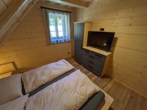 Vuode tai vuoteita majoituspaikassa Wellness Chalet Kohútka