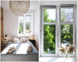 a bedroom with a bed and a window at Mini Loft Janickiego in Szczecin