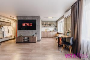 a room with a netflix sign on a wall at Двухкомнатные фирменные апартаменты Тиффани in Petropavlovsk