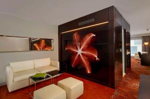 a living room with a couch and a table at Park Plaza London Westminster Bridge in London