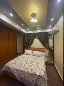 a bedroom with a large bed in a room at Luxury Duplex 450m 4BR For Familias in Cairo